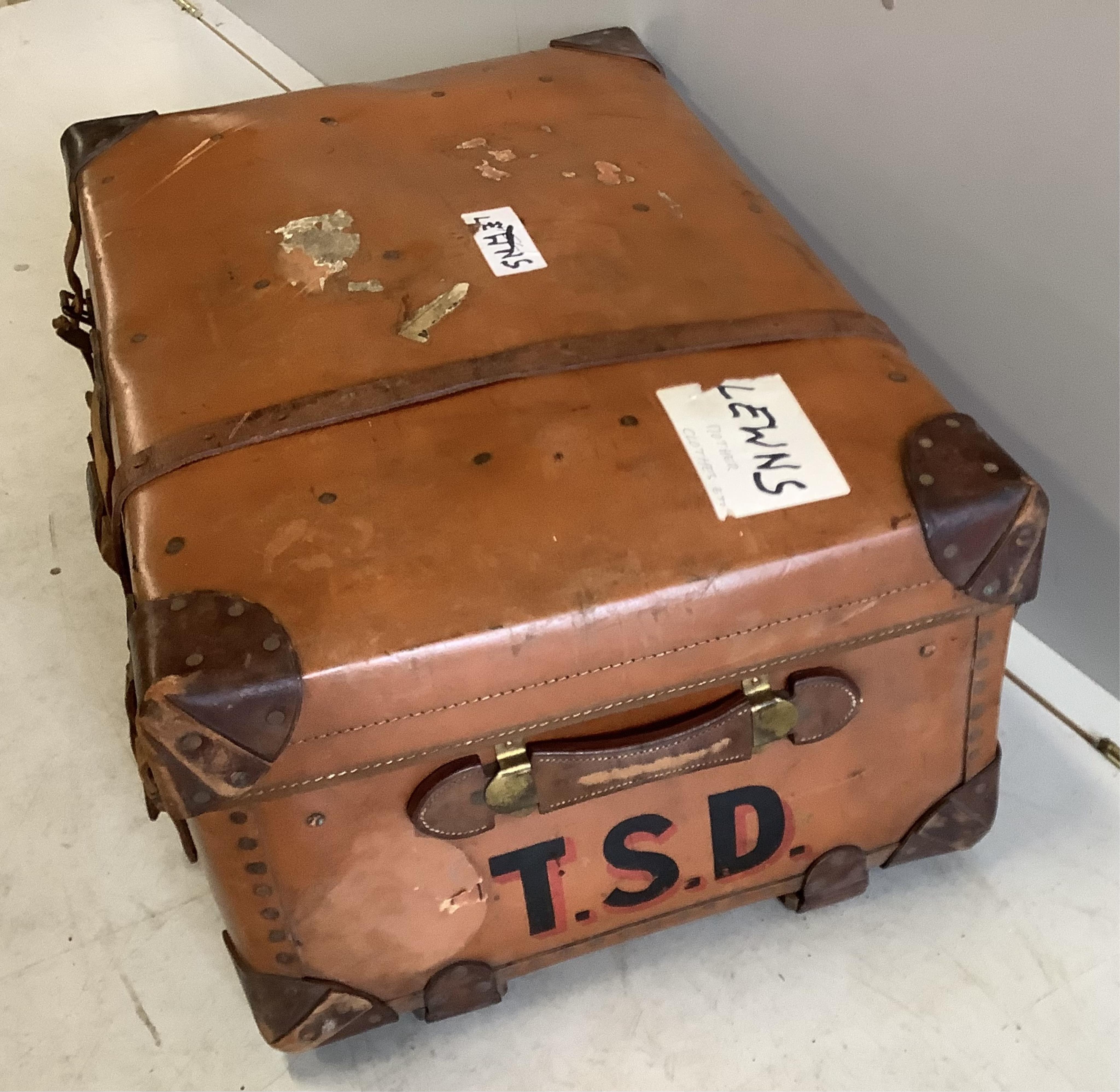 An early 20th century leather mounted travelling trunk, width 76cm, depth 52cm, height 32cm